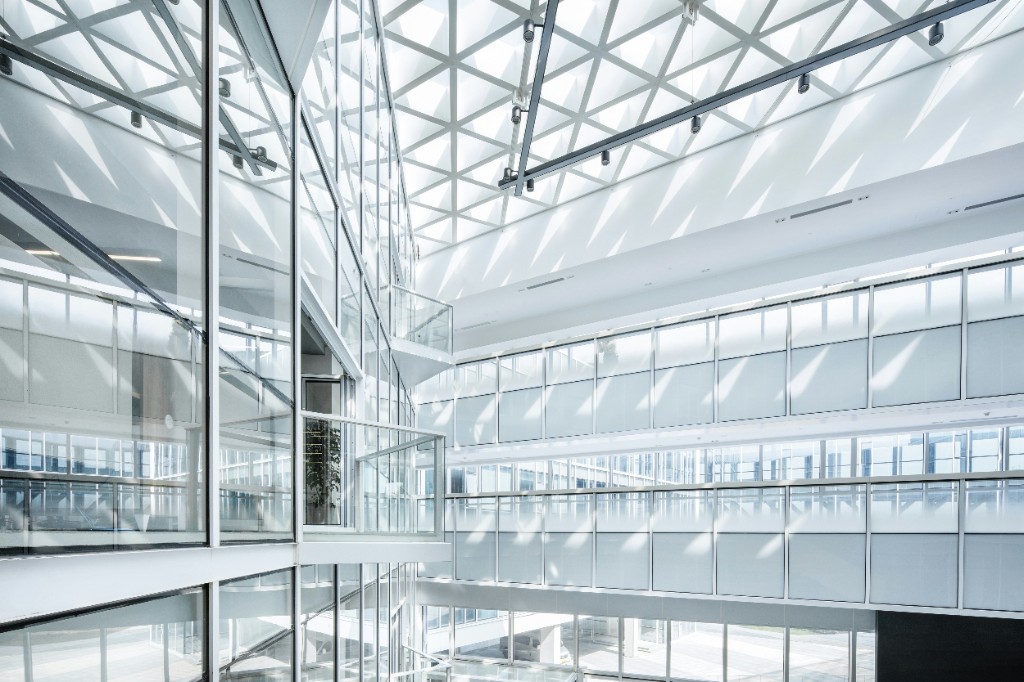 Modern glass atrium with geometric skylight